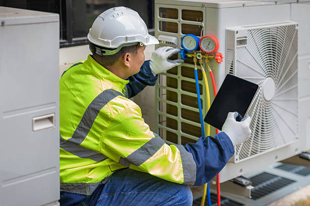 Professional Emergency Hvac Repair technician working in Fayetteville, AR